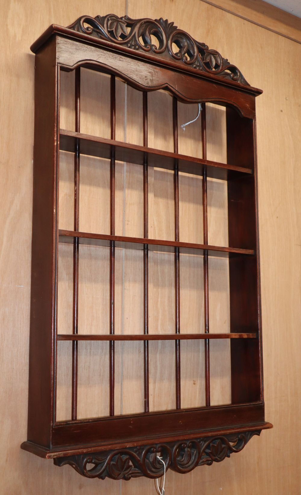 A mahogany four tier wall bracket, W.55cm, D.11cm, H.94cm,